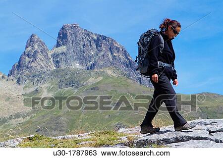 Mountaineer walking near Midi D? Ossau peak, in National Park des Pyrenees, in Bearn province Atlantics Pyrenees Aquitania, France Europe View Large Photo Image Stock Image - Mountaineer walking near Midi D? Ossau peak, in National Park des Pyrenees, in Bearn province Atlantics Pyrenees Aquitania, France Europe. Fotosearch
