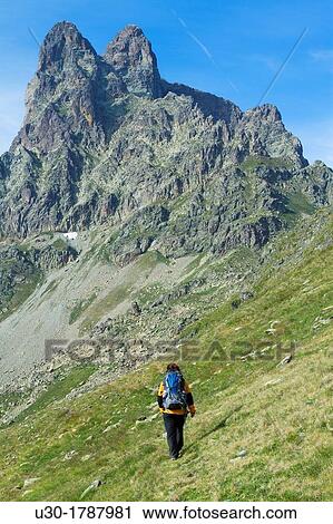 Mountaineer walking near Midi D? Ossau peak, in National Park des Pyrenees, in Bearn province Atlantics Pyrenees Aquitania, France Europe View Large Photo Image Stock Image - Mountaineer walking near Midi D? Ossau peak, in National Park des Pyrenees, in Bearn province Atlantics Pyrenees Aquitania, France Europe. Fotosearch