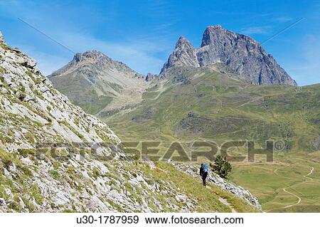Mountaineer walking near Midi D? Ossau peak, in National Park des Pyrenees, in Bearn province Atlantics Pyrenees Aquitania, France Europe View Large Photo Image Stock Photo - Mountaineer walking near Midi D? Ossau peak, in National Park des Pyrenees, in Bearn province Atlantics Pyrenees Aquitania, France Europe. Fotosearch