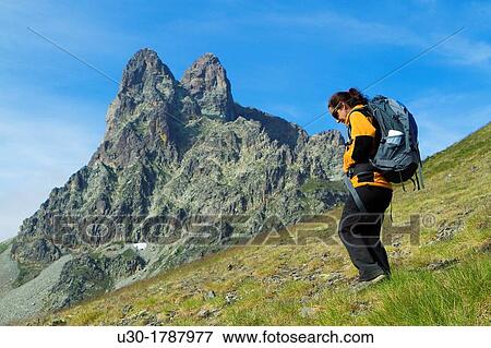 Mountaineer walking near Midi D? Ossau peak, in National Park des Pyrenees, in Bearn province Atlantics Pyrenees Aquitania, France Europe View Large Photo Image Stock Photo - Mountaineer walking near Midi D? Ossau peak, in National Park des Pyrenees, in Bearn province Atlantics Pyrenees Aquitania, France Europe. Fotosearch