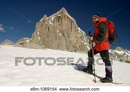 mountaineer walking with snowshoes in a snow-capped mountains landscape Picos de Europa National Park Cantabria Spain Europe View Large Photo Image Picture - mountaineer walking with snowshoes in a snow-capped mountains landscape Picos de Europa National Park Cantabria Spain Europe. Fotosearch