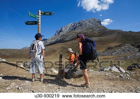 Mountaineers consulting a post with information in the Picos de Europa National Park, between the Urrieles and? ndara massifs, Cantabria, Spain View Large Photo Image Stock Photo - Mountaineers consulting a post with information in the Picos de Europa National Park, between the Urrieles and? ndara massifs, Cantabria, Spain. Fotosearch