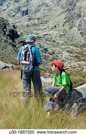 Mountaineers resting in Sierra de Gredos Regional Park,? vila Castilla y Le? n Spain View Large Photo Image Stock Image - Mountaineers resting in Sierra de Gredos Regional Park,? vila Castilla y Le? n Spain. Fotosearch