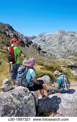 Stock Image - Mountaineers resting in Sierra de Gredos Regional Park,? vila Castilla y Le? n Spain. Fotosearch