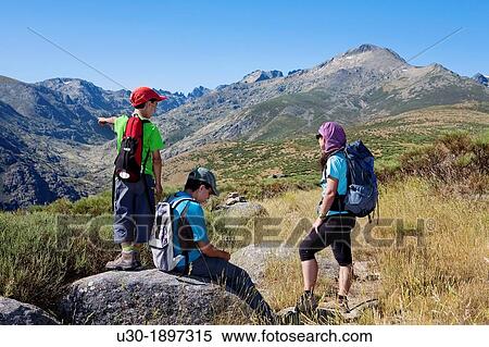 Stock Photography - Mountaineers resting in Sierra de Gredos Regional Park,? vila Castilla y Le? n Spain. Fotosearch