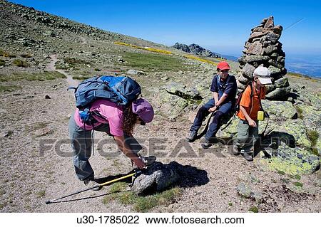 Mountaineers resting next to a boundary stone, in Biosphere Reserve of Sierra de B? jar and Francia Salamanca Candelario Castilla y Le? n Spain View Large Photo Image Stock Image - Mountaineers resting next to a boundary stone, in Biosphere Reserve of Sierra de B? jar and Francia Salamanca Candelario Castilla y Le? n Spain. Fotosearch