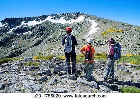 Stock Image - Mountaineers walking between the Biosphere Reserve of Sierra de B? jar and Francia Salamanca and Sierra de Gredos Regional Park? vila Castilla y Le? n Spain. Fotosearch