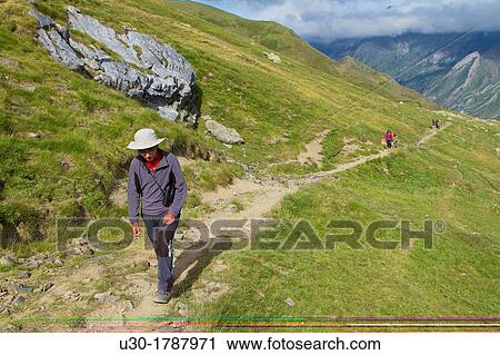 Stock Image - Mountaineers walking in Midi D? Ossau peak, in National Park des Pyrenees, in Bearn province Atlantics Pyrenees Aquitania, France Europe. Fotosearch