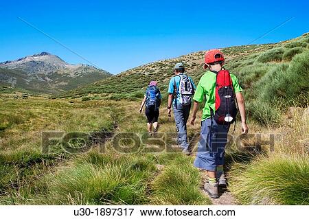 Stock Photo - Mountaineers walking in Sierra de Gredos Regional Park,? vila Castilla y Le? n Spain. Fotosearch