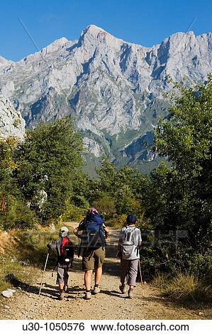 Mountaineers walking in the mountains of Andara Massif Brez, in the municipality of Camaleo, in the Li? bana Valley Picos de Europa National Park Cantabria Spain View Large Photo Image Stock Photograph - Mountaineers walking in the mountains of Andara Massif Brez, in the municipality of Camaleo, in the Li? bana Valley Picos de Europa National Park Cantabria Spain. Fotosearch