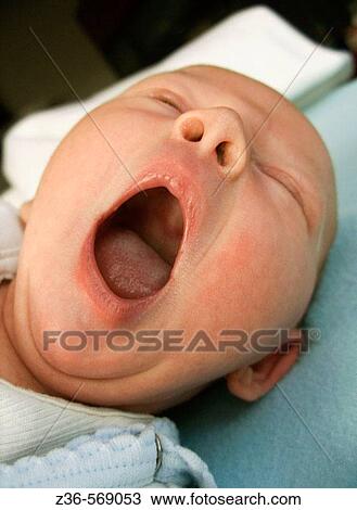 Stock Image - Mouth of one week old girl. Fotosearch