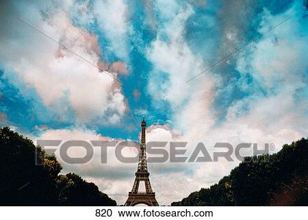 Moving clouds captured in multi-color behind the Eiffel Tower, Paris View Large Photo Image Stock Image - Moving clouds captured in multi-color behind the Eiffel Tower, Paris. Fotosearch