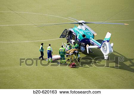 Stock Image - Moving of a patient in helicopter, emergency. Hospital de Zumarraga, Gipuzkoa, Euskadi. Spain.. Fotosearch
