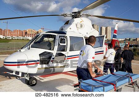 Moving of a patient in helicopter, emergency. Hospital Universitario Gran Canaria Doctor Negrin, Las Palmas de Gran Canaria. Canary Islands, Spain View Large Photo Image Stock Photograph - Moving of a patient in helicopter, emergency. Hospital Universitario Gran Canaria Doctor Negrin, Las Palmas de Gran Canaria. Canary Islands, Spain. Fotosearch