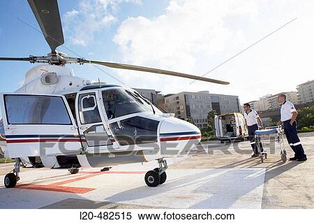 Moving of a patient in helicopter, emergency. Hospital Universitario Gran Canaria Doctor Negrin, Las Palmas de Gran Canaria. Canary Islands, Spain View Large Photo Image Stock Photography - Moving of a patient in helicopter, emergency. Hospital Universitario Gran Canaria Doctor Negrin, Las Palmas de Gran Canaria. Canary Islands, Spain. Fotosearch