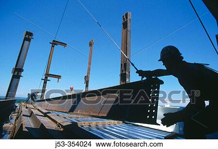 Moving steel beam. Esquire Plaza Building. Sacramento, California. USA. View Large Photo Image Picture - Moving steel beam. Esquire Plaza Building. Sacramento, California. USA.. Fotosearch
