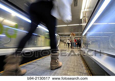 Stock Photo - Moving walkway, Diagonal metro station, Barcelona, Catalonia, Spain. Fotosearch