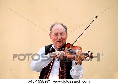 Stock Image - Mr Alexander Klebercz playing the violin. Fotosearch