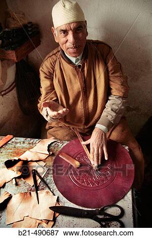 Stock Photo - Mr. Mohamed Naji,? maalem? in leather, at his workshop, in the Medina of Fes. Morocco.. Fotosearch