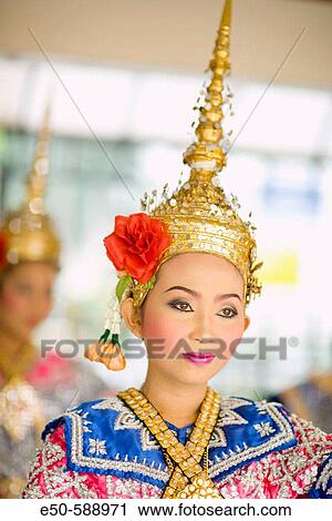 Stock Image - MR tradtitional Thai Dancers performing near Erawan Shrine, Chit Lom, Bangkok, Thailand. Fotosearch