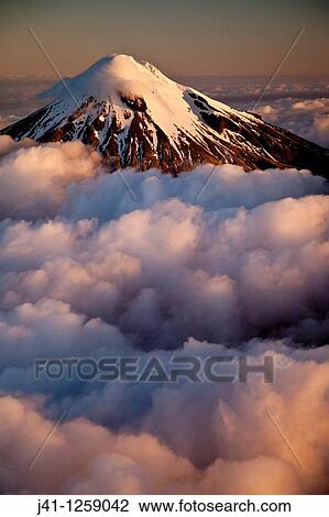 Mt Egmont / Taranaki, western flanks of dormant volcano above evening cloud, sunset, Taranaki. View Large Photo Image Stock Image - Mt Egmont / Taranaki, western flanks of dormant volcano above evening cloud, sunset, Taranaki.. Fotosearch