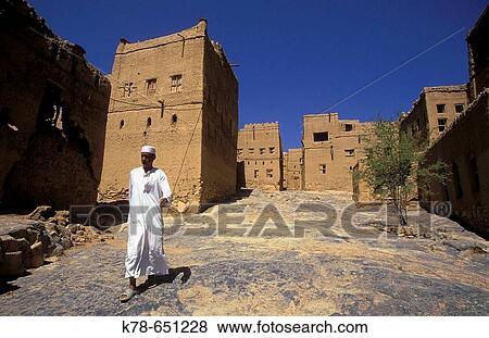Mud brick houses at Al Hamra village, one of the oldest villages in Oman. Hajar Mountains, Oman. View Large Photo Image Stock Photo - Mud brick houses at Al Hamra village, one of the oldest villages in Oman. Hajar Mountains, Oman.. Fotosearch