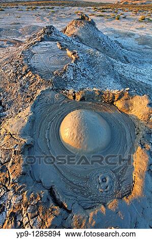 Mud erupting from a mud volcano, Qobustan, Azerbaijan View Large Photo Image Picture - Mud erupting from a mud volcano, Qobustan, Azerbaijan. Fotosearch