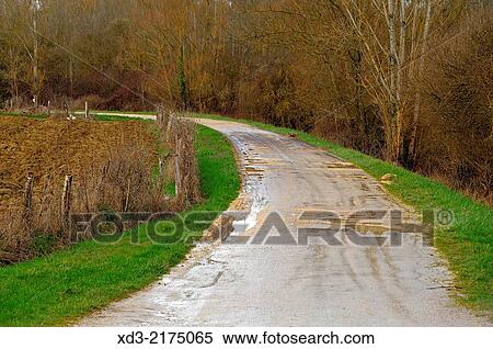 muddy road near Laperche, Lot-et-Garonne Department, Aquitaine, France. View Large Photo Image Stock Photography - muddy road near Laperche, Lot-et-Garonne Department, Aquitaine, France.. Fotosearch