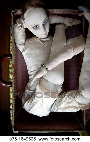 mueca de trapo plegada en una maleta, folded rag doll in a suitcase View Large Photo Image Stock Photography - mueca de trapo plegada en una maleta, folded rag doll in a suitcase. Fotosearch