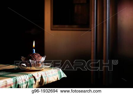 muffin with candle View Large Photo Image Picture - muffin with candle. Fotosearch