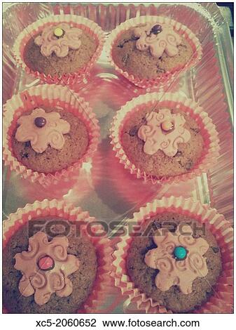 Muffins with flower decoration View Large Photo Image Stock Image - Muffins with flower decoration. Fotosearch