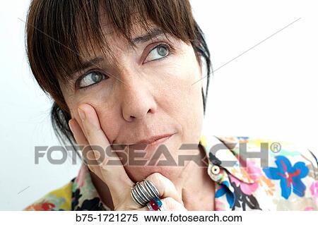 Stock Photography - mujer con la mano en la cara pensativa, confusa y espectante, woman with hand on her face thoughtful, confused and expectant,. Fotosearch