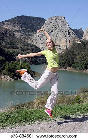 Mujer de 30 aos saltando delante del Pantano de El Chorro, rio Gudalhorce, Ardales, MBlaga View Large Photo Image Stock Image - Mujer de 30 aos saltando delante del Pantano de El Chorro, rio Gudalhorce, Ardales, MBlaga. Fotosearch