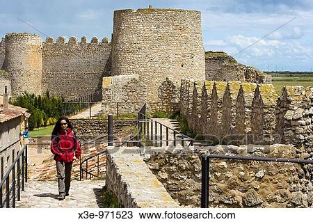 Mujer paseando por las murallas de la Villa del Libro Uruea View Large Photo Image Stock Image - Mujer paseando por las murallas de la Villa del Libro Uruea. Fotosearch