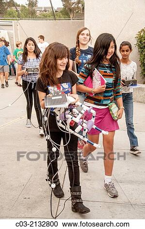 Multiracial middle school students in Mission Viejo, CA, prepare to test the remote operated submarine vehicles (ROV) they built in their robotics classroom in an outdoor pool. View Large Photo Image Stock Image - Multiracial middle school students in Mission Viejo, CA, prepare to test the remote operated submarine vehicles (ROV) they built in their robotics classroom in an outdoor pool.. Fotosearch