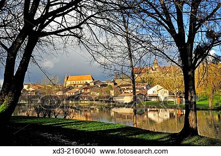 Stock Image - municipal park with Eglise Saint Etienne and Ducal Castle, Lauzun, Lot-et-Garonne Department, Aquitaine, France.. Fotosearch