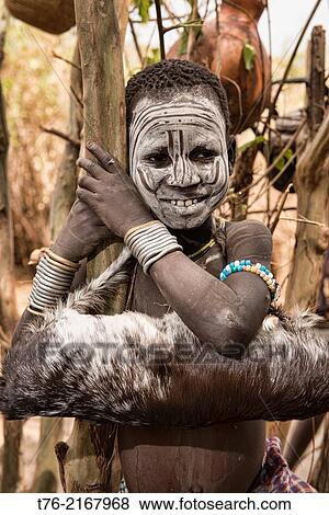 Mursi boy in the Lower Omo Valley of Ethiopia. View Large Photo Image Stock Photo - Mursi boy in the Lower Omo Valley of Ethiopia.. Fotosearch