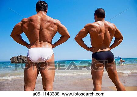 Muscular man. Bodybuilder. Aguas Blancas Beach. Ibiza. Balearic Islands. Spain. View Large Photo Image Stock Photo - Muscular man. Bodybuilder. Aguas Blancas Beach. Ibiza. Balearic Islands. Spain.. Fotosearch
