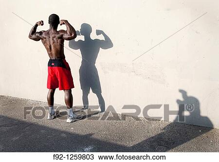 Muscural man possing for the camera in Venice beach, California. View Large Photo Image Stock Image - Muscural man possing for the camera in Venice beach, California.. Fotosearch