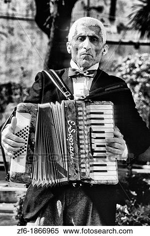 Stock Photography - Music man playing accordian in Sorrento Italy. Fotosearch
