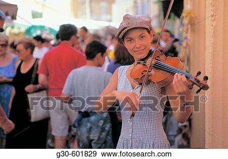 Music student playing violin. Nyons market day. Provence. France View Large Photo Image Stock Photo - Music student playing violin. Nyons market day. Provence. France. Fotosearch