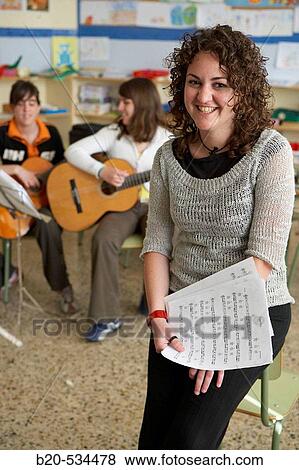 Music teacher, guitar instruction View Large Photo Image Stock Photo - Music teacher, guitar instruction. Fotosearch