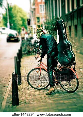 musician in a street Amsterdam, Holland, Netherlands, Europe View Large Photo Image Picture - musician in a street Amsterdam, Holland, Netherlands, Europe. Fotosearch