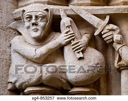 Musician with wind instrument carved on capital by master mason Reinard de Fonoll, East gallery of 14th century Gothic cloister, Cistercian monastery of Santes Creus. Aiguamurcia, Alt Camp, Tarragona province, Catalonia, Spain View Large Photo Image Stock Photo - Musician with wind instrument carved on capital by master mason Reinard de Fonoll, East gallery of 14th century Gothic cloister, Cistercian monastery of Santes Creus. Aiguamurcia, Alt Camp, Tarragona province, Catalonia, Spain. Fotosearch