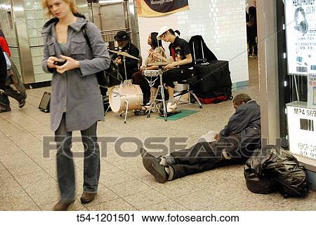 Musicians, homeless people and a passer-by in Times Square Subwastation View Large Photo Image Stock Image - Musicians, homeless people and a passer-by in Times Square Subwastation. Fotosearch