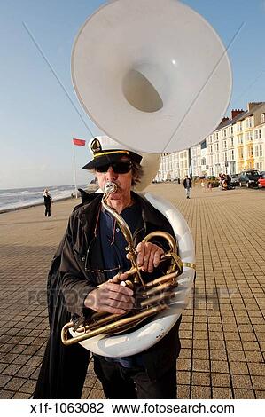Musicians in the De Propere Fanfare belgian marching band performing on the promenade, Aberystwyth Wales UK View Large Photo Image Stock Image - Musicians in the De Propere Fanfare belgian marching band performing on the promenade, Aberystwyth Wales UK. Fotosearch
