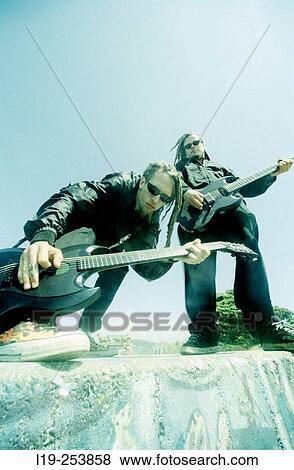 Musicians playing guitar View Large Photo Image Stock Photo - Musicians playing guitar. Fotosearch