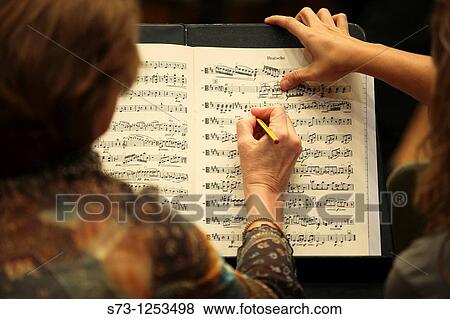 Musicians with a score View Large Photo Image Stock Photo - Musicians with a score. Fotosearch