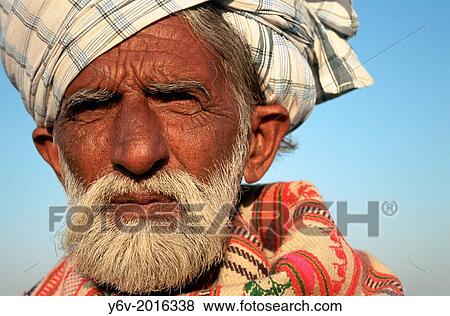 Muslim breeder belonging to the Sindhi community. Thar desert, India. View Large Photo Image Stock Photo - Muslim breeder belonging to the Sindhi community. Thar desert, India.. Fotosearch