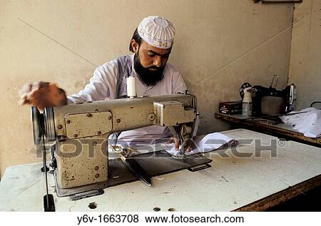 Muslim man sewing in India View Large Photo Image Stock Photo - Muslim man sewing in India. Fotosearch